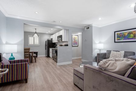 Open-concept kitchen & living area designed for easy cooking & hangouts.