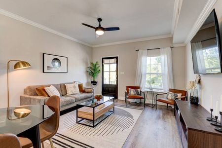Bright, stylish living room w/ modern décor & ample seating — perfect for gathering after a day out.