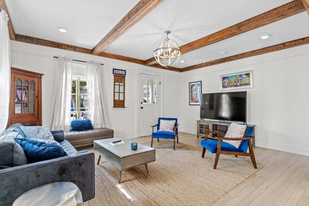 Living room w/ ample seating, TV & streaming services ready to go.
