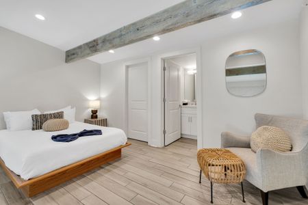 Spacious bed w/ seating area & direct ensuite access for added comfort.