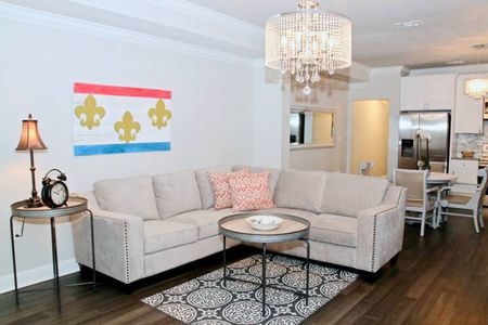 Curl up in the bright, airy living room w/ plush seating & cozy accents.