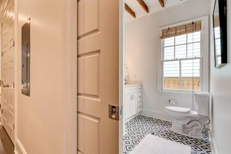 Convenient half bath tucked in & ready for guests.