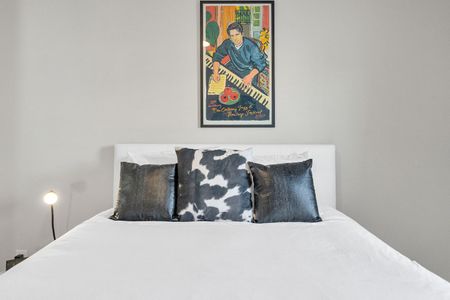 Bold patterned bedding & vibrant art make this room full of personality.