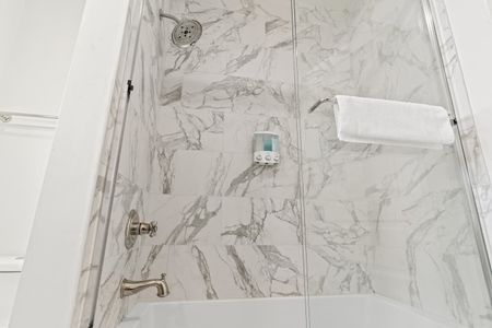 Marble-look flooring detail in the bathroom.