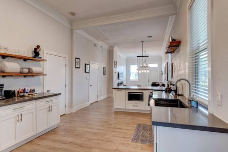 Bright, open kitchen w/ clean lines & modern finishes — ready for your next home-cooked meal.