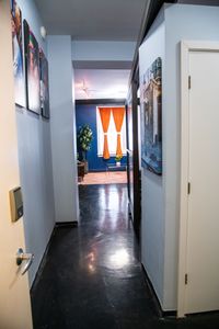 Colorful hallway w/ local artwork — character & charm at every turn.