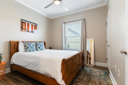 Bright bedroom w/ a full-length mirror & closet — everything you need to settle in.