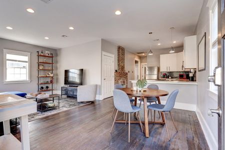 Charming dining area w/ natural light & seating for four — great for family meals together.