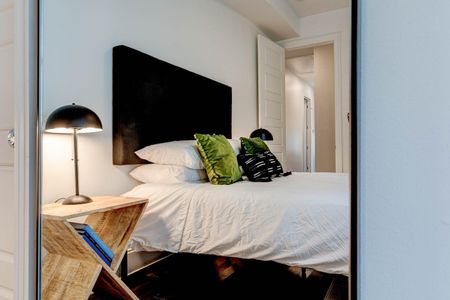 Third bedroom featuring a queen bed & curated decor for a comfortable stay.
