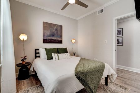 Bright queen bedroom w/ clean, classic style for a restful night's sleep.