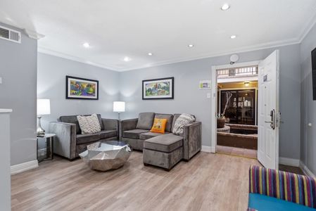 Kick back in this welcoming living area w/ plush seating & warm natural light.