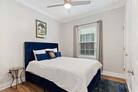 Bright first bedroom w/ a comfy queen bed down the hall.