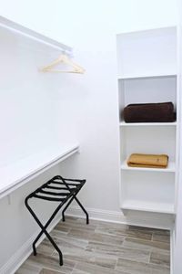 Clean, minimalist bedroom w/ built-in storage for a clutter-free stay.