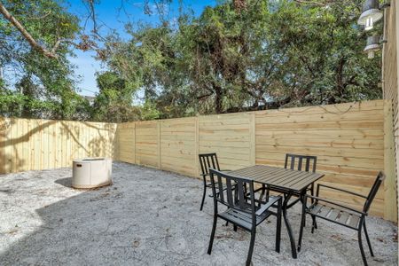 Private fenced patio w/ a dining table & chairs — your own outdoor retreat.