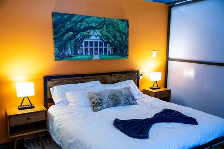 Rest easy in this warm, inviting bedroom w/ rich tones & New Orleans charm.