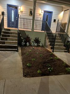 Beautifully landscaped front steps leading up to your home away from home.