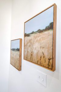 Statement artwork w/ warm golden tones adding depth & character to the space.