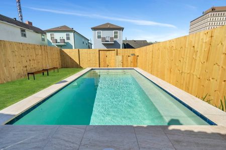 The fully-fenced pool from above — plenty of room to swim, splash & soak up the sun.