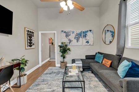 Bright, airy living space w/ a world map accent & plenty of room to unwind.
