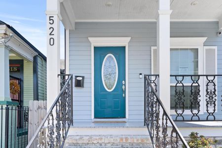 Welcoming teal front door sets the tone the moment you arrive.