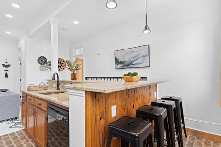 Bar seating & dining area — a great spot to share a meal or morning coffee.