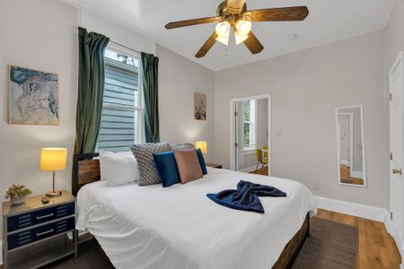 Restful bedroom w/ crisp blue & white bedding and a calm, soothing atmosphere.