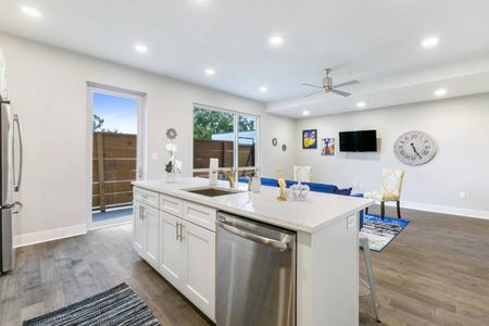 Well-appointed kitchen w/ island, stainless appliances & ample cabinet space.