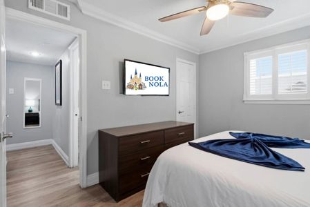 Sleep in style in this sleek bedroom w/ dark wood furniture & clean lines.