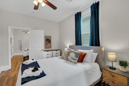 Serene, light-filled bedroom w/ a clean, minimal feel made for deep rest.