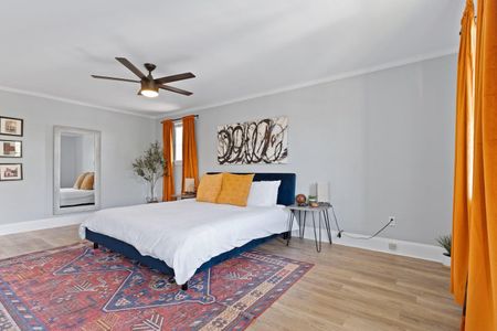 Comfortable bed bathed in warm light — your restful retreat awaits.