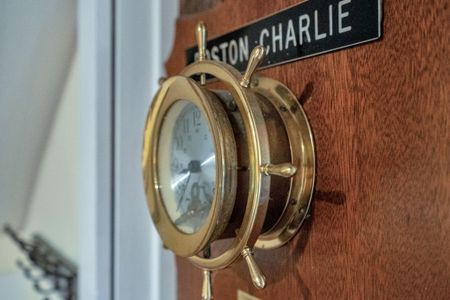 Stunning maritime porthole mirror — a nod to the city's portside heritage.