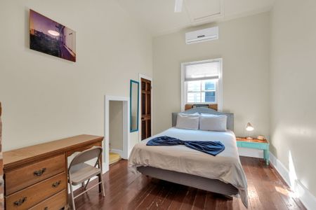 Serene bedroom w/ soft linens & a calm, uncluttered feel.