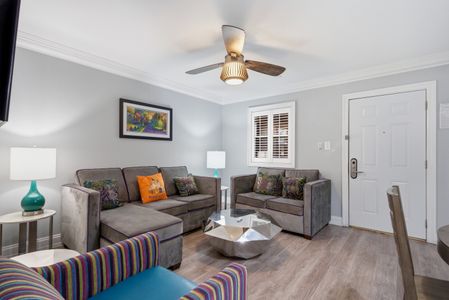 Kick back in the living room w/ cozy sofas & warm accent pillows.