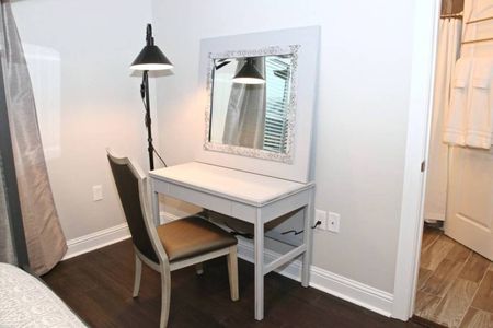 Dedicated workspace w/ a desk & mirror — ideal for remote work.