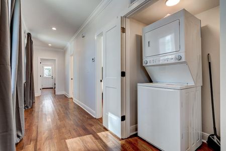 Convenient in-unit washer & dryer tucked into a tidy laundry space.