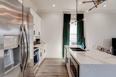 Functional kitchen w/ modern appliances & stylish teal accents throughout.