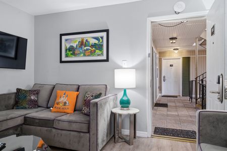 Living room w/ a view straight to the entryway — open & welcoming.