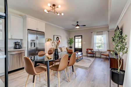 Spacious dining area w/ a table ideal for sharing meals together.