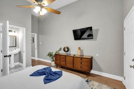 Bedroom w/ smart TV & wood dresser — everything you need for a comfortable stay.