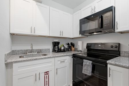Sleek kitchen w/ modern appliances & plenty of counter space