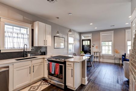 Open kitchen flowing into the dining space — everything you need right at your fingertips.