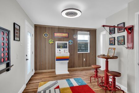 Vibrant game room w/ arcade games & bold décor — the ultimate hangout spot.