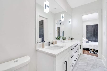 Upstairs Jack & Jill full bathroom w/ double vanity — bright, clean & shared w/ style.
