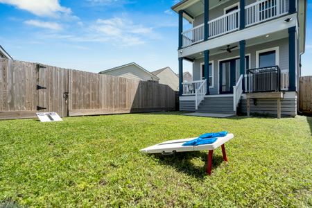Spacious backyard w/ cornhole & a sun-drenched lawn made for gatherings & good times.