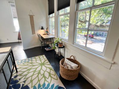 Sun-filled nook w/ a desk & garden views — your quiet work-from-home corner.