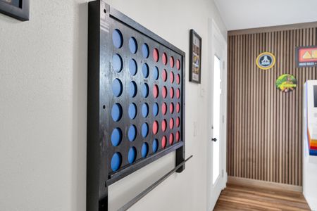 Oversized Connect Four on the wall — perfect for friendly competition any time.
