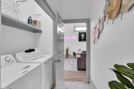 Laundry area w/ washer & dryer tucked neatly for easy, convenient access.