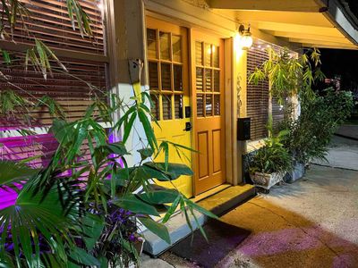 Warmly lit entrance w/ golden doors — welcoming you back no matter the hour.