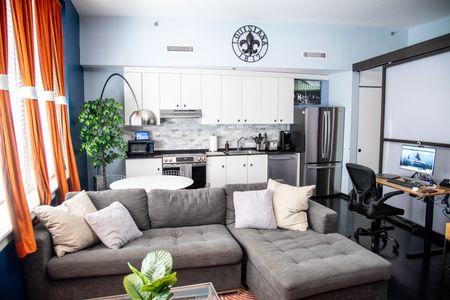 Bright, open-concept kitchen & living area made for cooking, lounging & gathering.