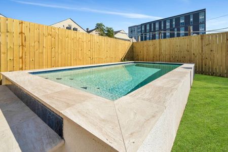 Crystal-clear pool gleaming in the sun, fully fenced for total privacy.